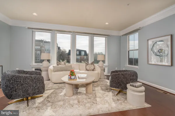 a living room with furniture and a table