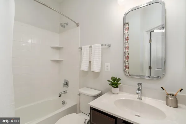 a view of a hallway with washer and dryer
