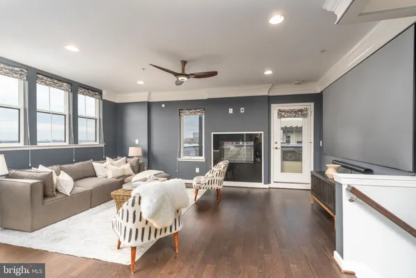 a living room with furniture and windows