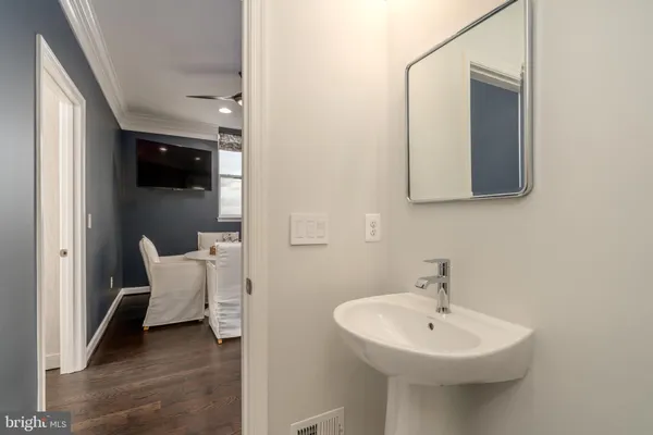 a view of a open kitchen with a sink and dishwasher
