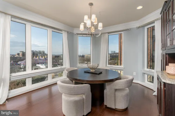 a spacious bedroom with a bed and a potted plant