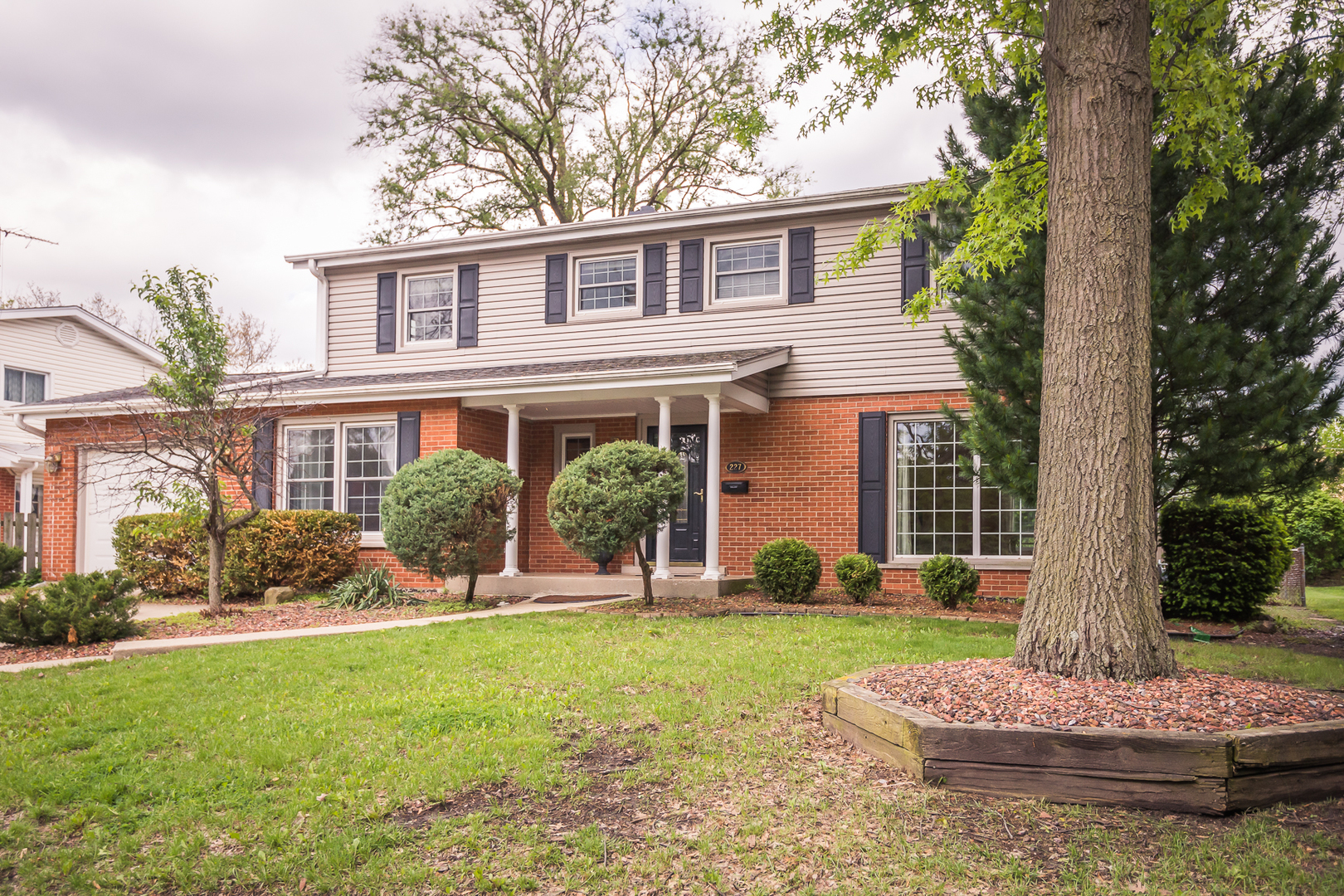 227 Country Club Drive Addison, IL 60101 - Photo 2 of 39 a front view of a house with a yard