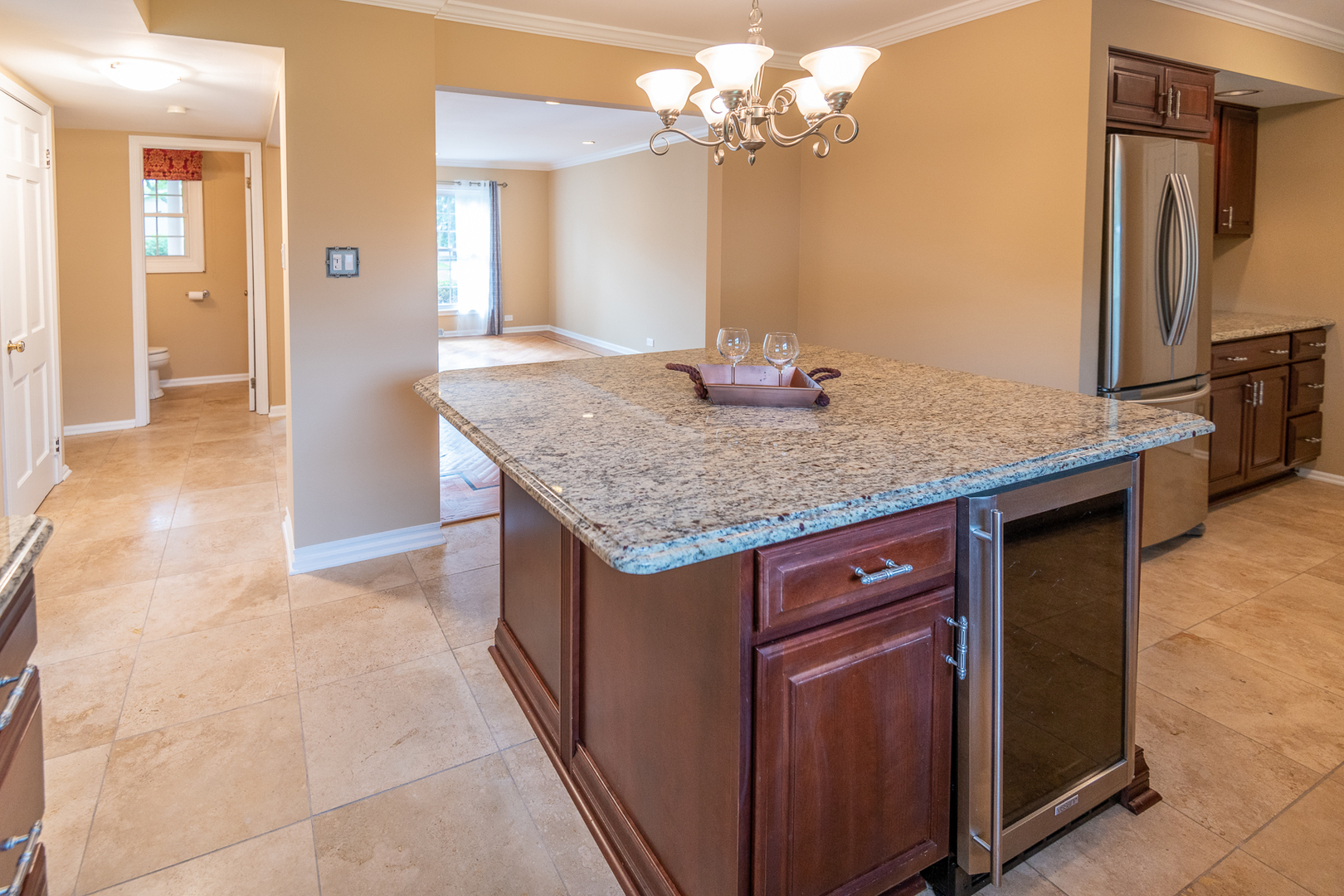 227 Country Club Drive Addison, IL 60101 - Photo 12 of 39 a bathroom with a granite countertop sink a mirror and a vanity