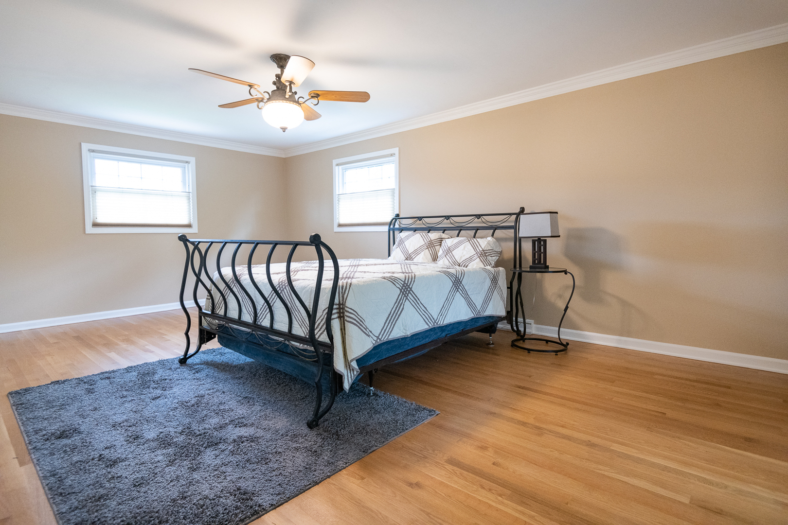 227 Country Club Drive Addison, IL 60101 - Photo 19 of 39 a bed sitting in a bedroom next to a window