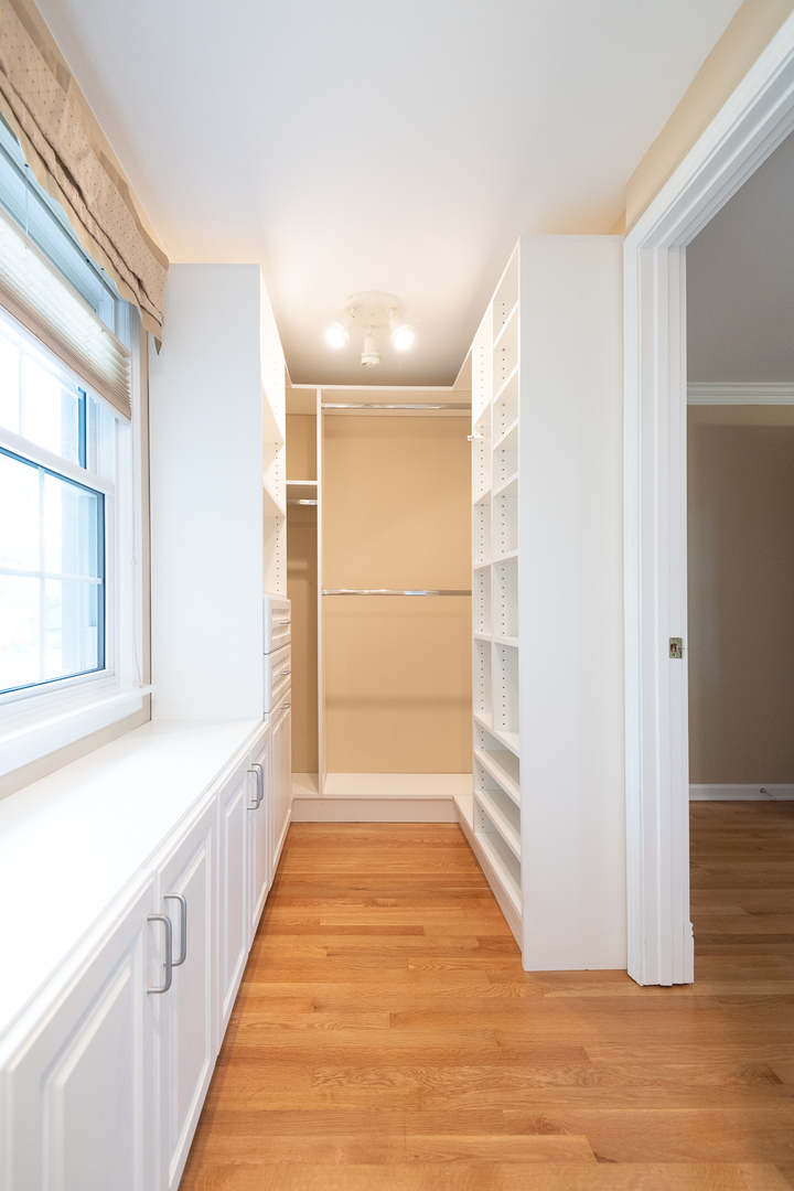227 Country Club Drive Addison, IL 60101 - Photo 24 of 39 a view of an empty room with wooden floor and a window