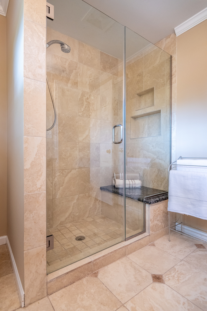 227 Country Club Drive Addison, IL 60101 - Photo 26 of 39 a bathroom with a bathtub and a shower