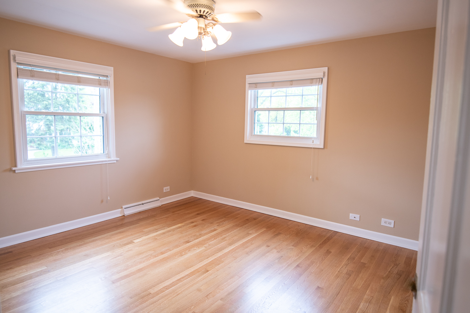 227 Country Club Drive Addison, IL 60101 - Photo 27 of 39 a view of an empty room with wooden floor and a window