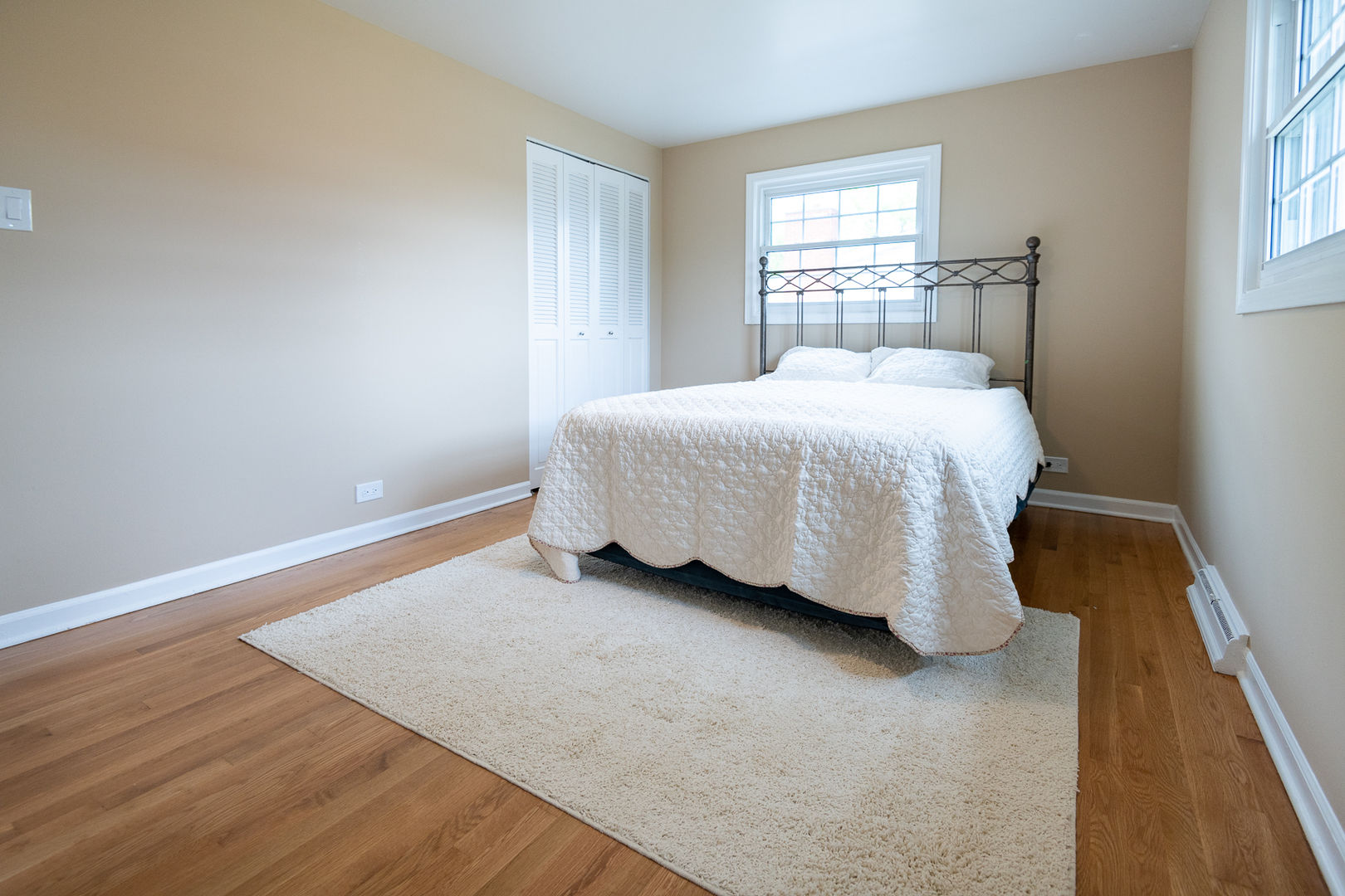 227 Country Club Drive Addison, IL 60101 - Photo 29 of 39 a spacious bedroom with a bed and a window