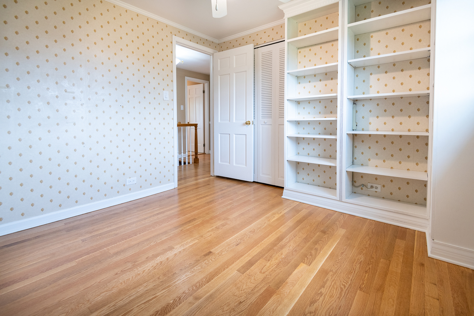 227 Country Club Drive Addison, IL 60101 - Photo 30 of 39 a view of an empty room with a window and wooden floor
