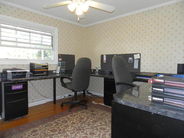 227 Country Club Drive Addison, IL 60101 - Photo 31 of 39 a view of a workspace with furniture and a window