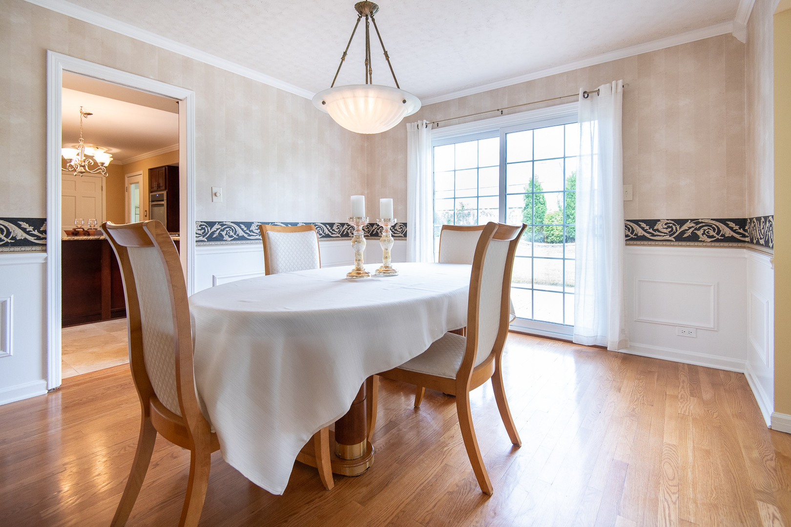 227 Country Club Drive Addison, IL 60101 - Photo 7 of 39 a view of a dining room with furniture window and wooden floor