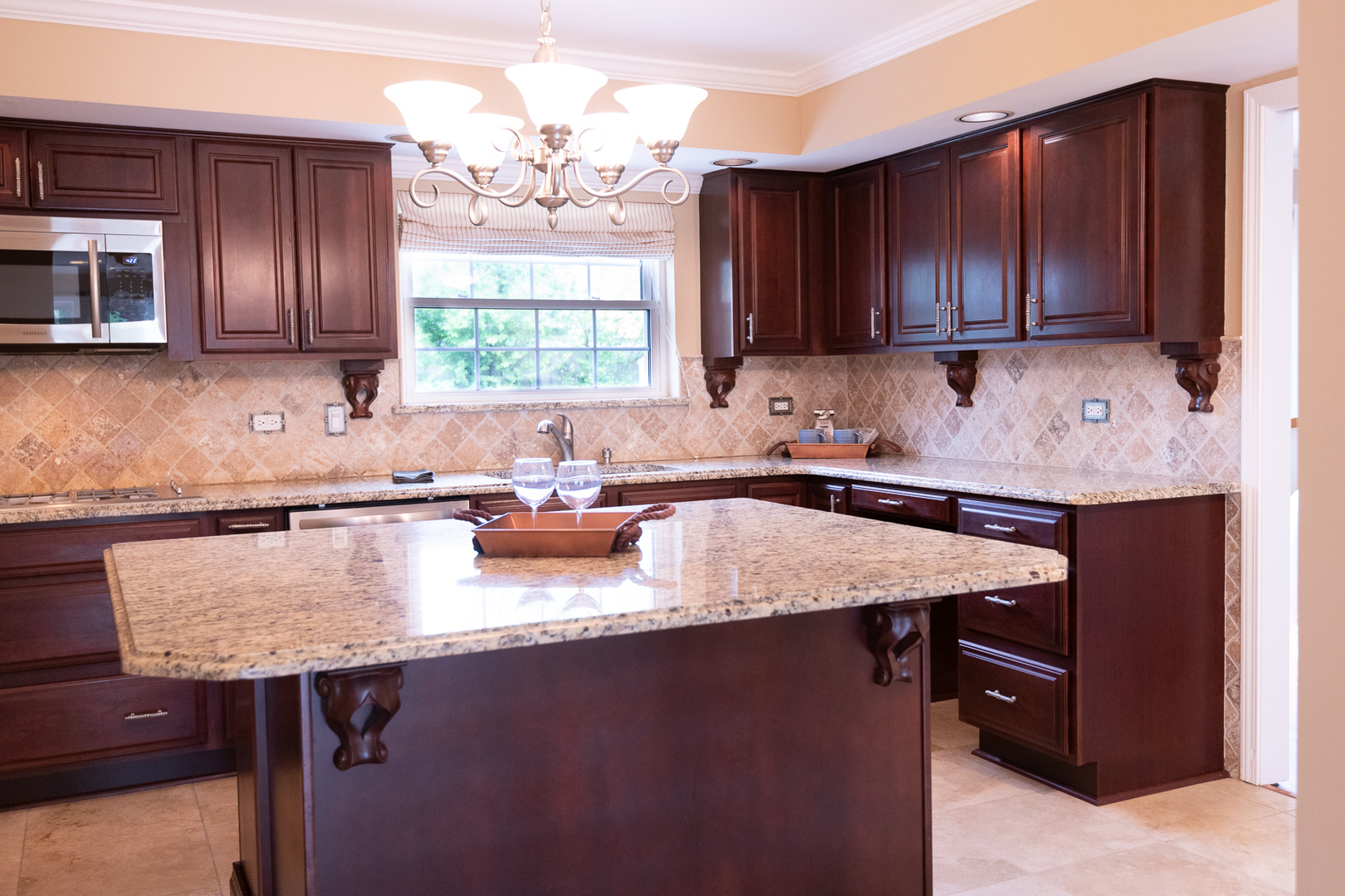 227 Country Club Drive Addison, IL 60101 - Photo 8 of 39 a kitchen with kitchen island granite countertop wooden cabinets a sink and dishwasher