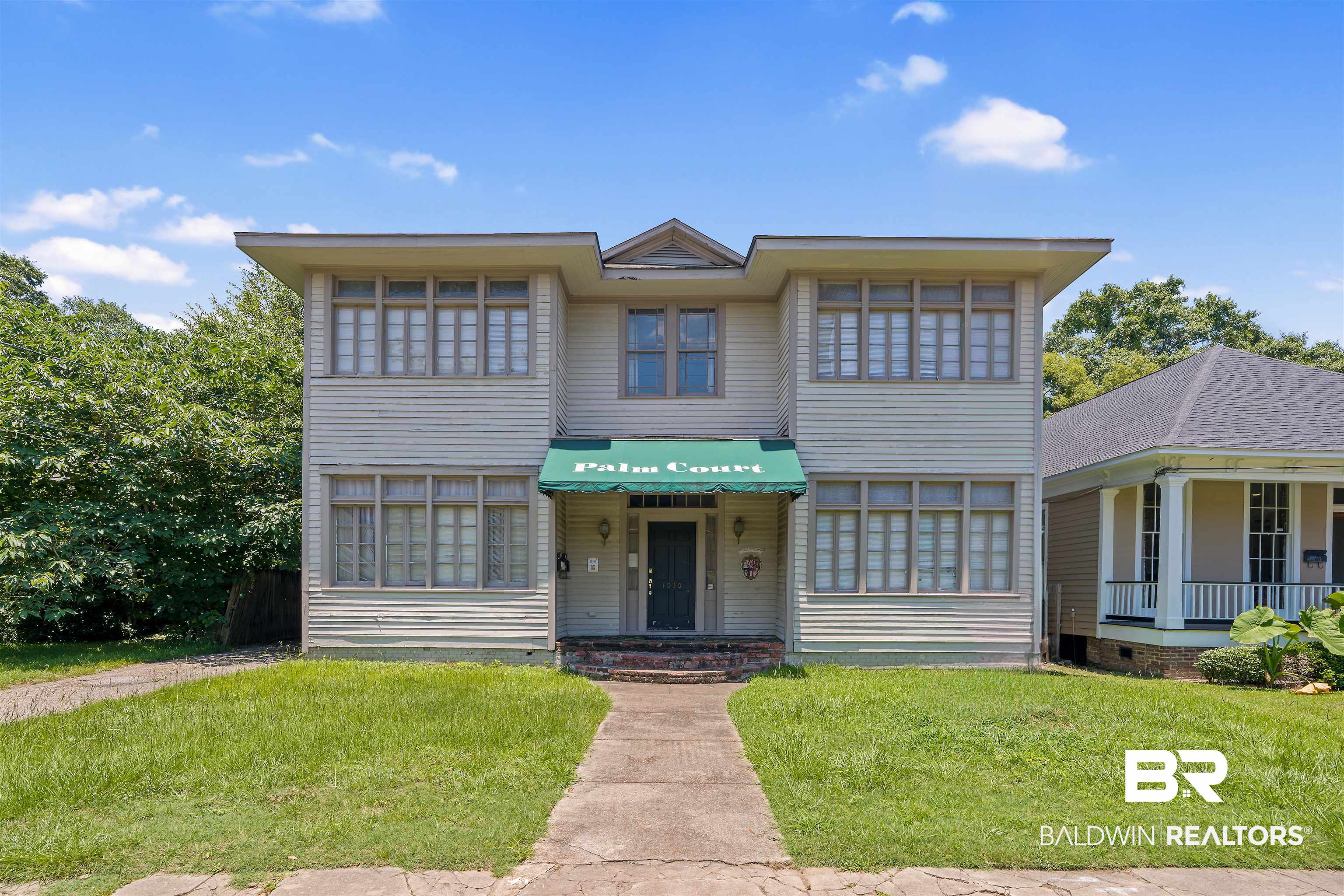 1010 Dauphin Street Mobile, AL 36604 - Photo 2 of 22 View of front of home with a front yard and covered porch