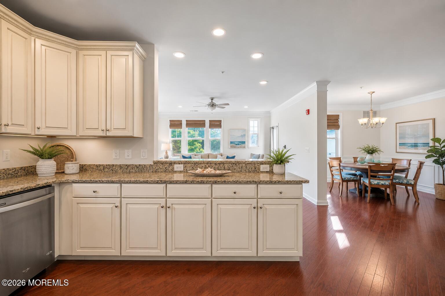2201 River Road, Unit 4207 Point Pleasant, NJ 08742 - Photo 6 of 34 a kitchen with a sink cabinets and dining table chair