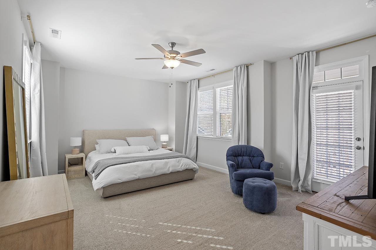 1445 Commons Ford Place Apex, NC 27539 - Photo 21 of 34 a bedroom with furniture and a window