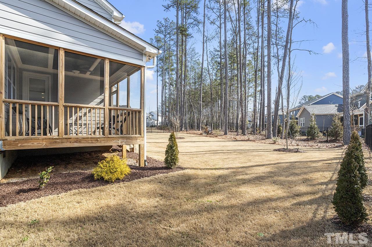 1445 Commons Ford Place Apex, NC 27539 - Photo 31 of 34 a view of a patio with a yard
