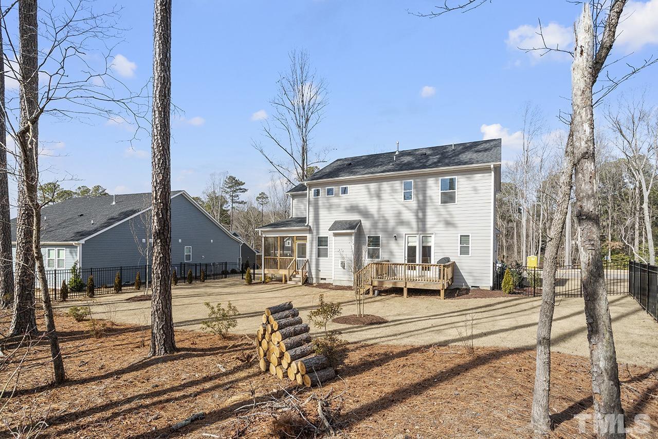 1445 Commons Ford Place Apex, NC 27539 - Photo 33 of 34 a view of a street with houses on the road