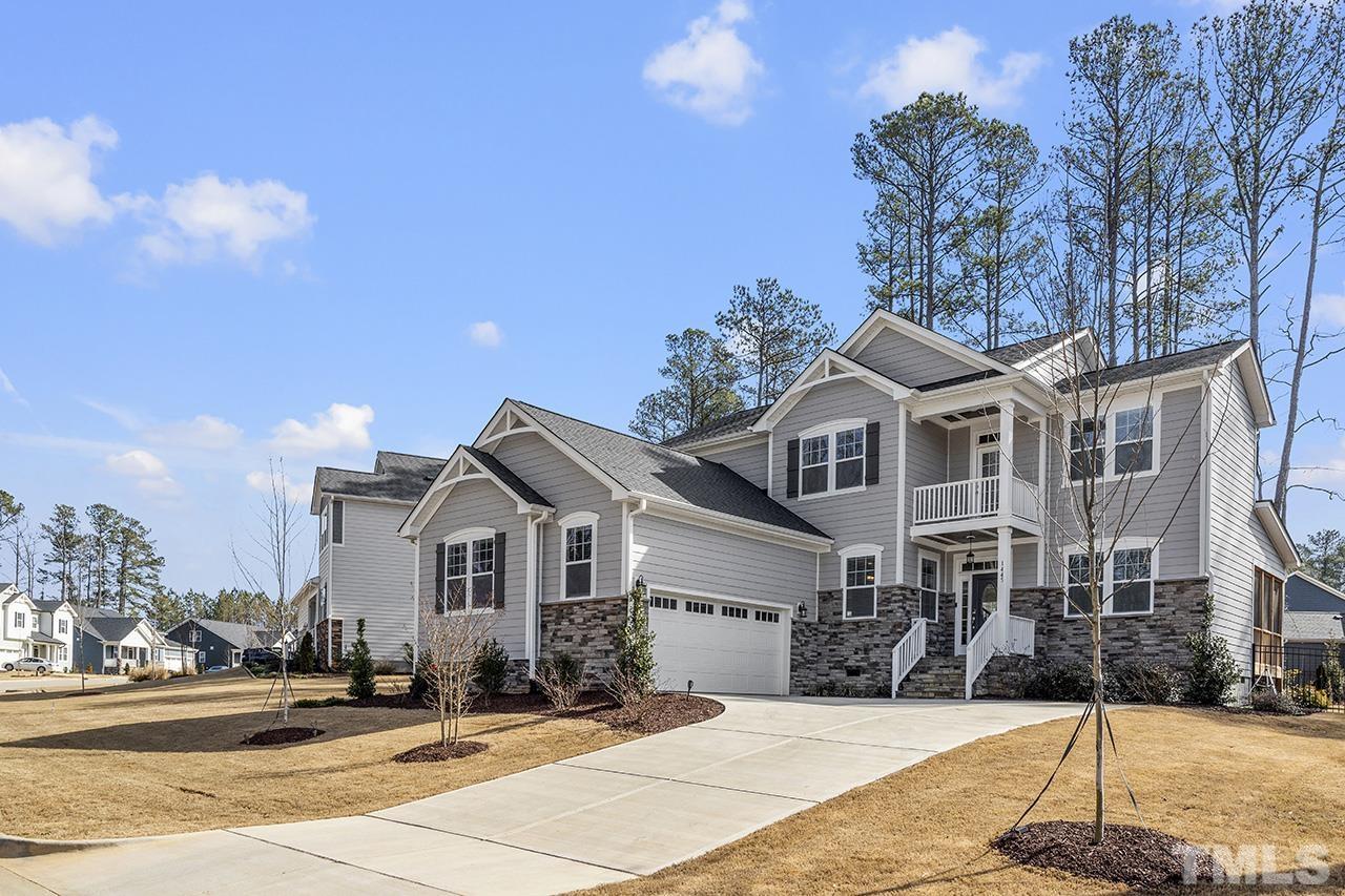 1445 Commons Ford Place Apex, NC 27539 - Photo 34 of 34 a front view of a house with a yard