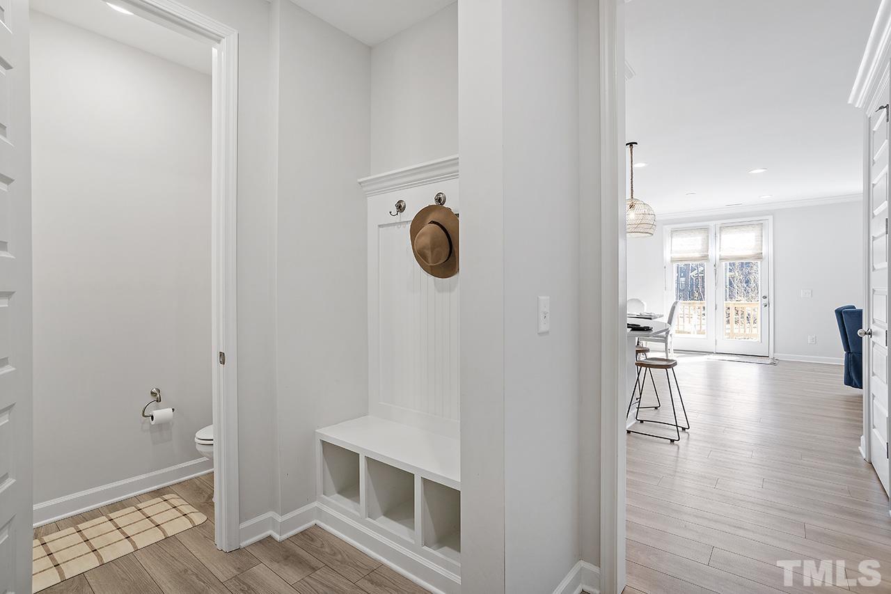 1445 Commons Ford Place Apex, NC 27539 - Photo 8 of 34 a hallway with wooden floor