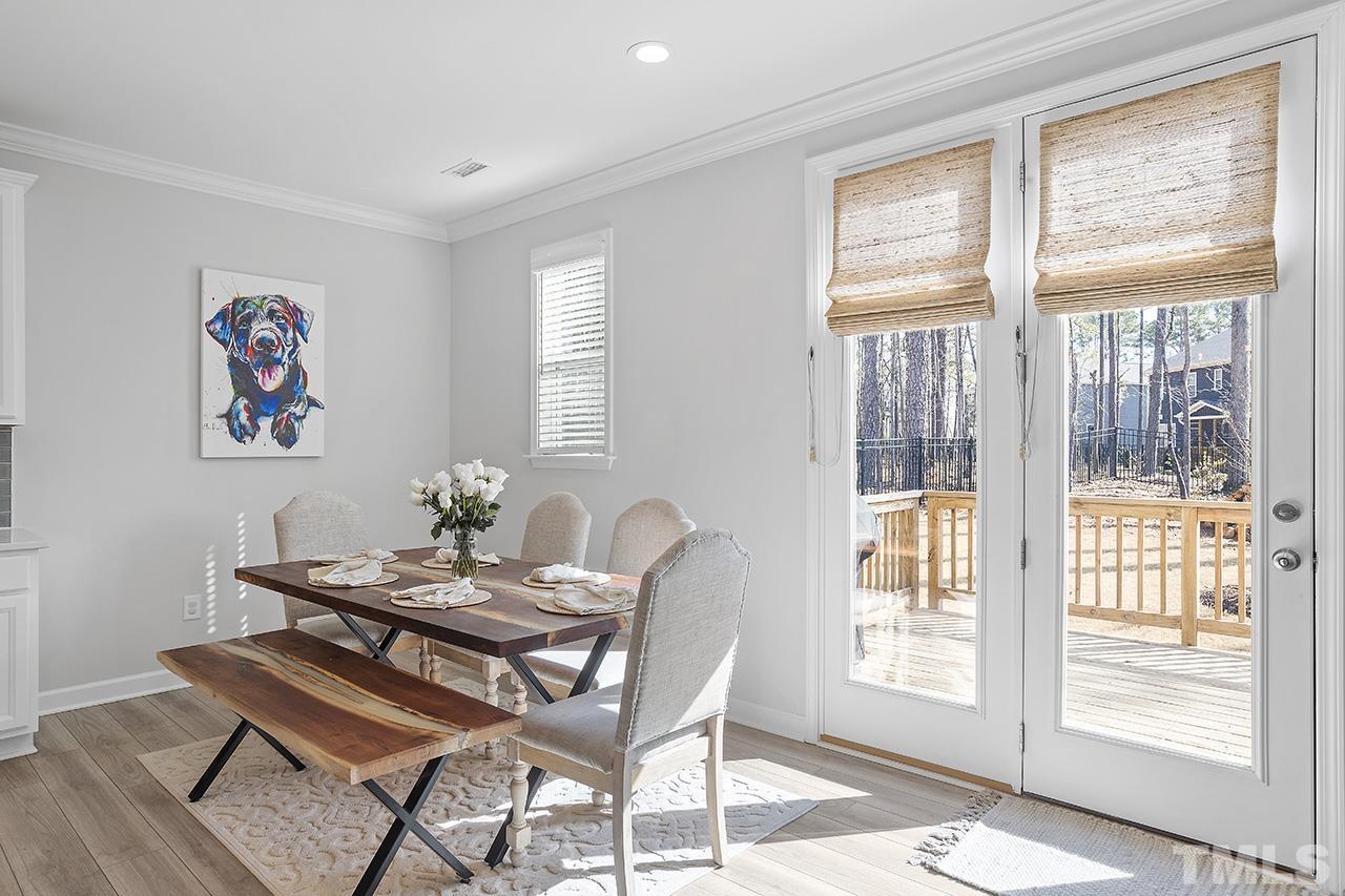 1445 Commons Ford Place Apex, NC 27539 - Photo 10 of 34 a view of a livingroom with furniture and a window