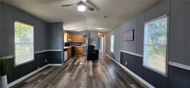 a view of kitchen with cabinets and wooden floor