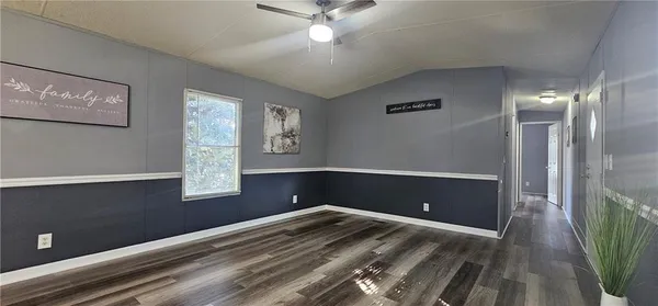 a view of room with window and ceiling fan