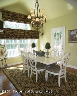 875 Sheffield Road Shavertown, PA 18708 - Photo 8 of 17 a view of a dining room with furniture and chandelier