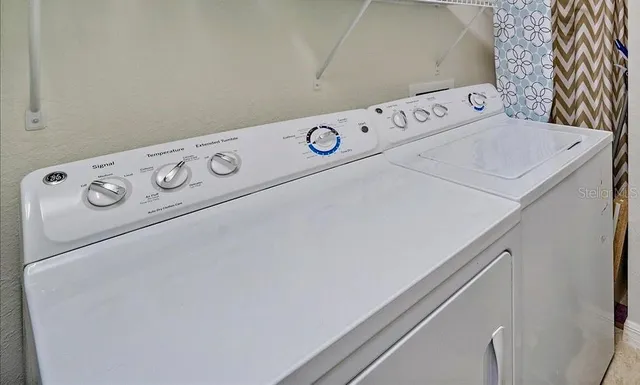 a utility room with dryer and washer