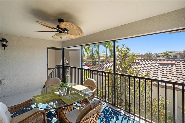 a view of a balcony with furniture