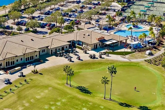 an aerial view of residential houses with swimming pool