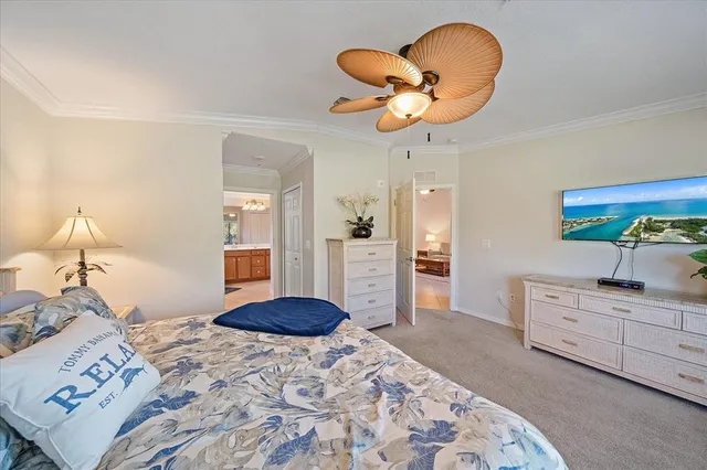 a bedroom with a bed and cabinets