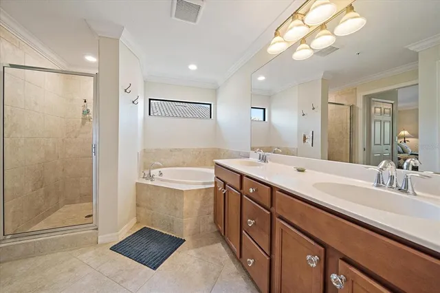a bathroom with a double vanity sink mirror and shower