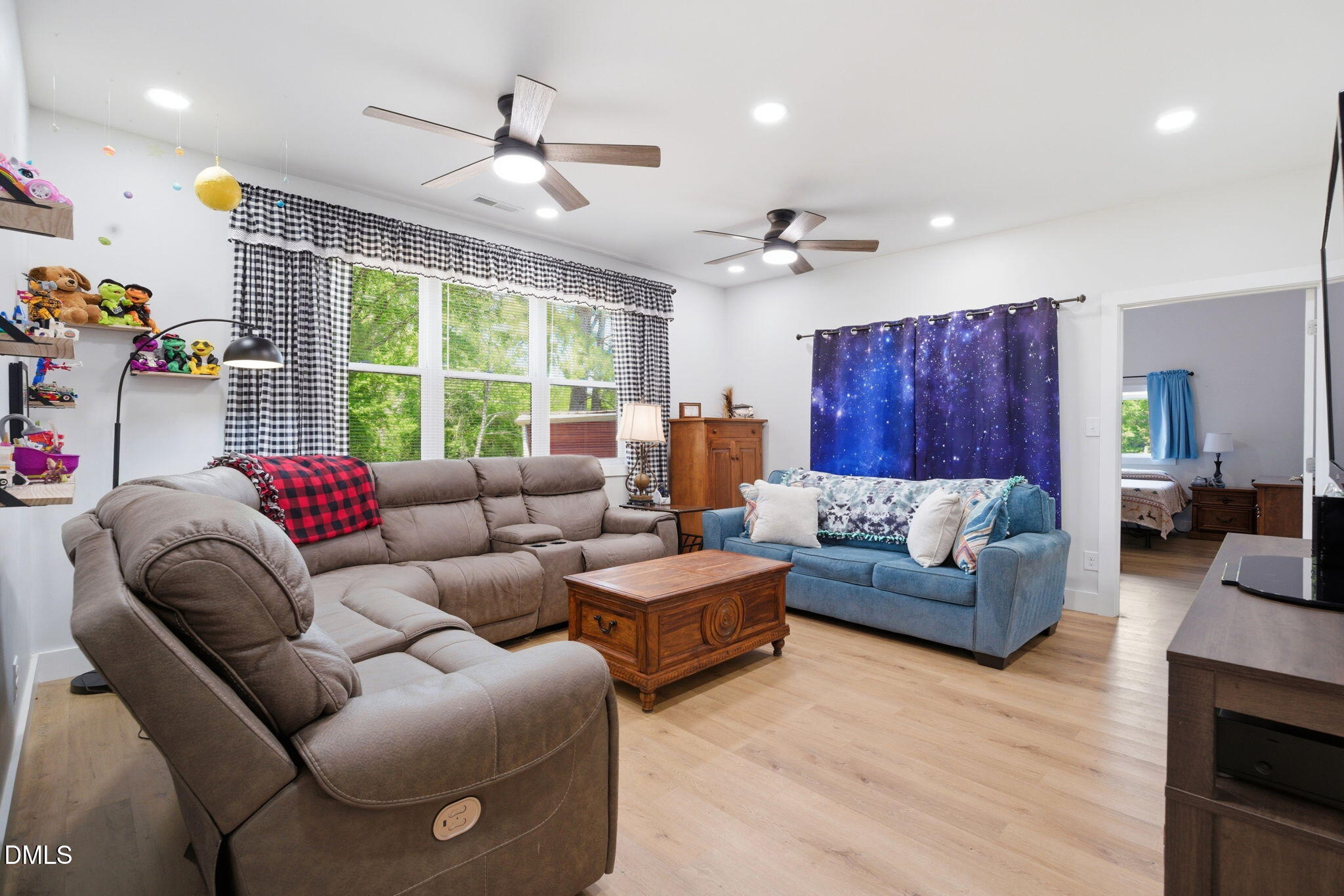 5416 Pulley Town Road Zebulon, NC 27597 - Photo 57 of 74 a living room with furniture and a large window