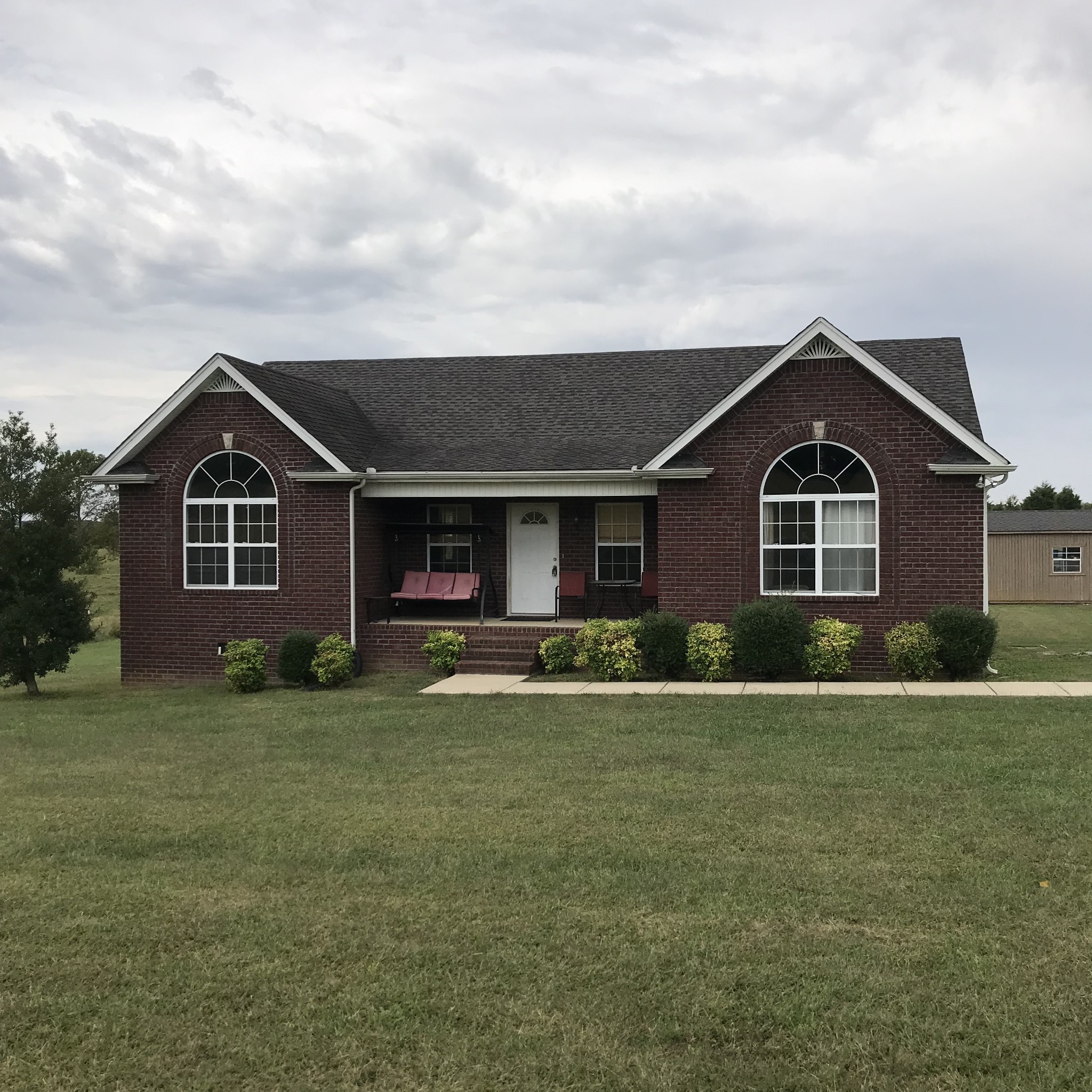 347 Freeland Road Portland, TN 37148 - Photo 1 of 13 a front view of a house with a yard