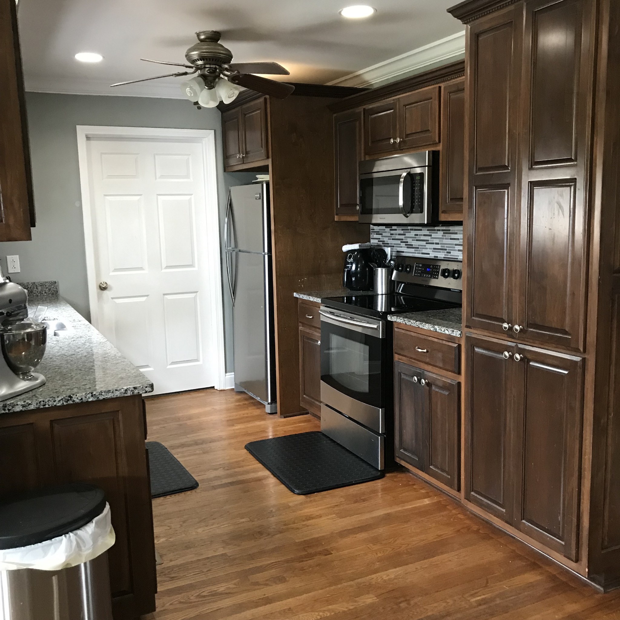 347 Freeland Road Portland, TN 37148 - Photo 5 of 13 a kitchen with granite countertop a refrigerator stove and microwave