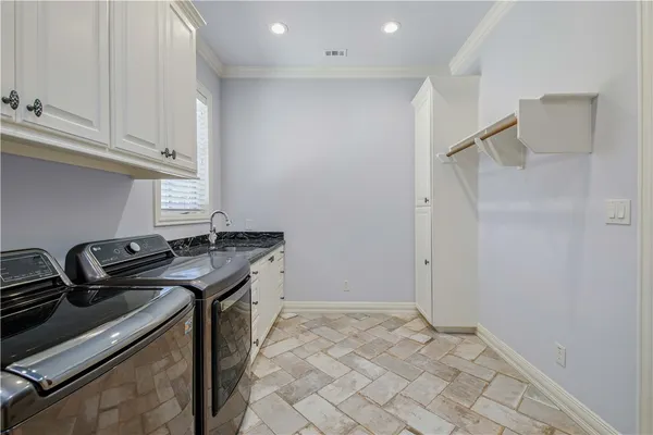 a kitchen that has a sink and a stove
