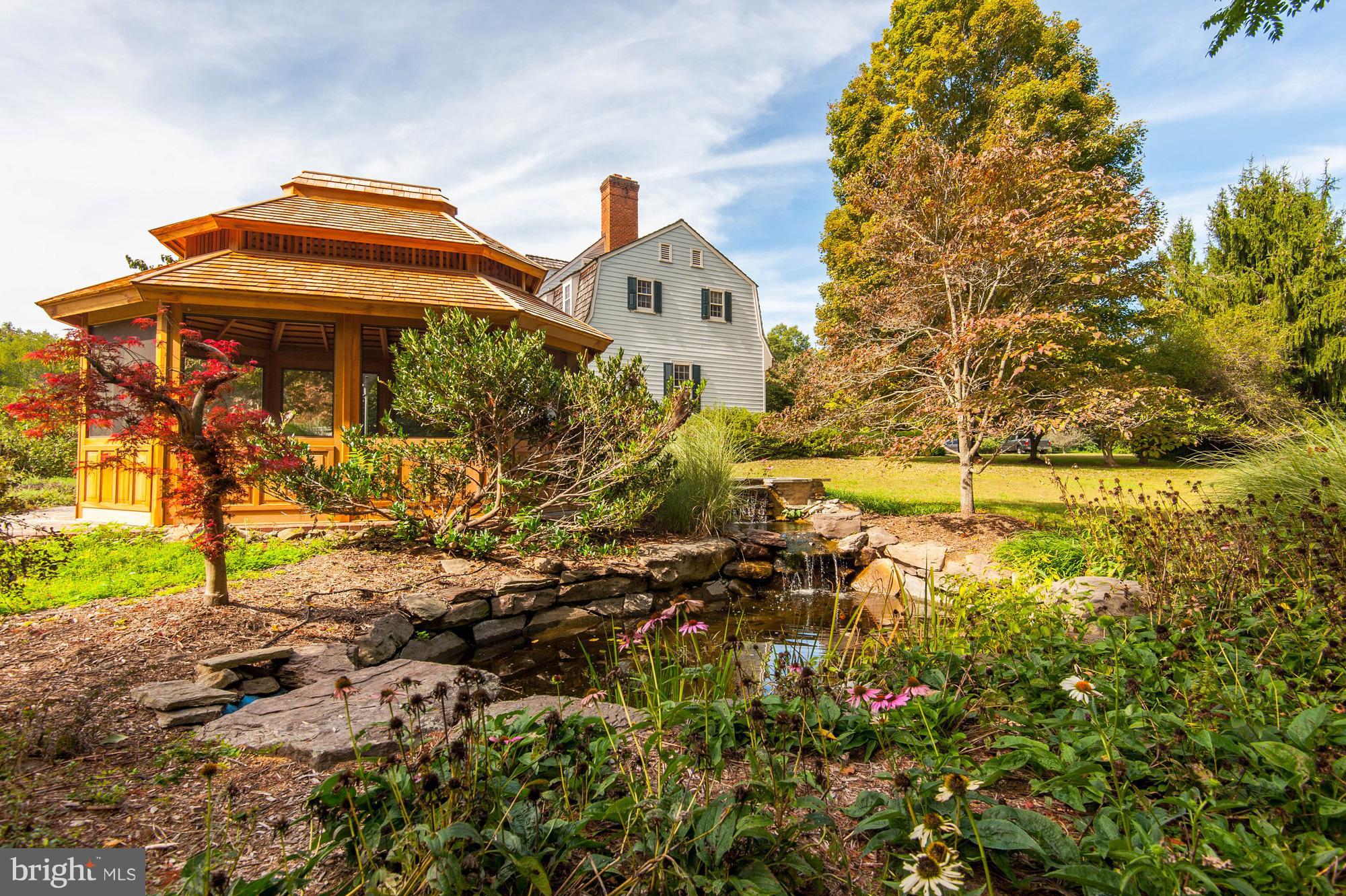 23355 Parsons Road Middleburg, VA 20117 - Photo 25 of 30 Koi Pond w/fountain curves around the Garden House