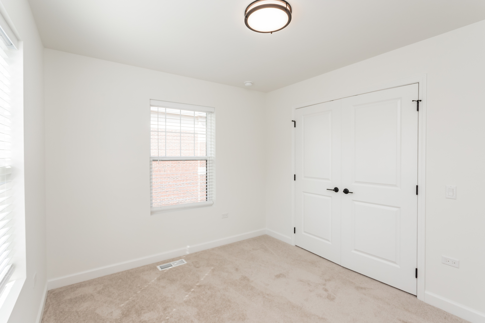 1432 North Naperville Wheaton Road, Unit 114 Naperville, IL 60563 - Photo 11 of 15 a view of a window in an empty room