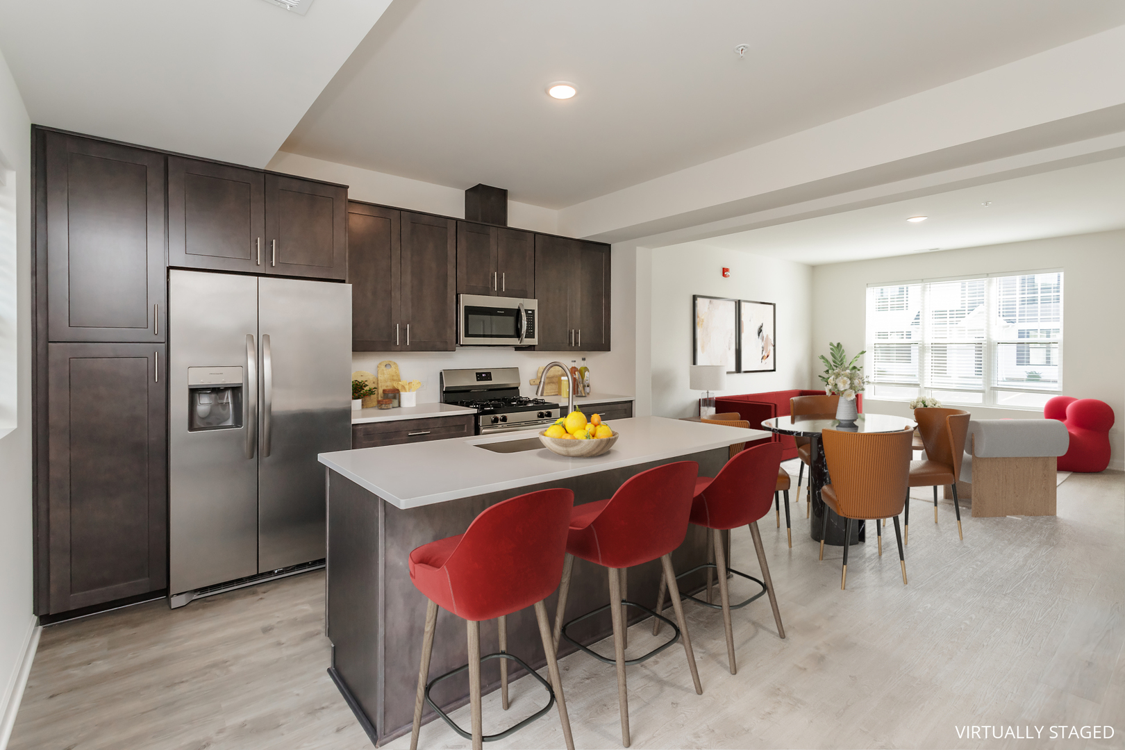 1432 North Naperville Wheaton Road, Unit 114 Naperville, IL 60563 - Photo 2 of 15 a kitchen with stainless steel appliances granite countertop a dining table chairs refrigerator and microwave