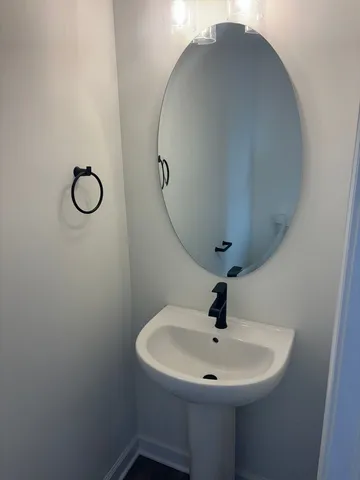 a bathroom with a sink and mirror