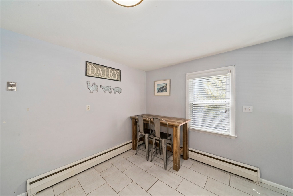 55 Running Brook Road Boston, MA 02132 - Photo 15 of 32 a view of a workspace with furniture and a window