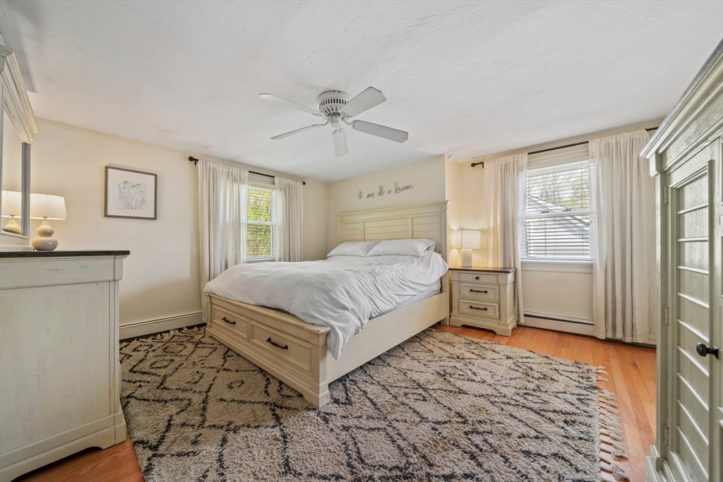 55 Running Brook Road Boston, MA 02132 - Photo 17 of 32 a bedroom with a bed and a window