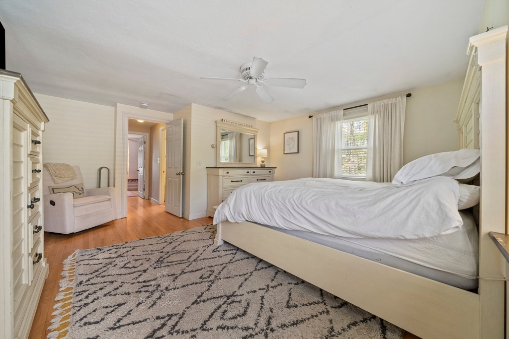 55 Running Brook Road Boston, MA 02132 - Photo 18 of 32 a bedroom with a bed and couch