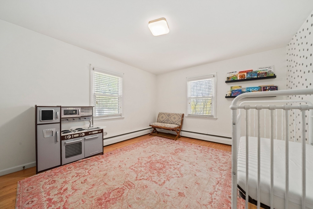 55 Running Brook Road Boston, MA 02132 - Photo 26 of 32 a kitchen with a refrigerator and a stove