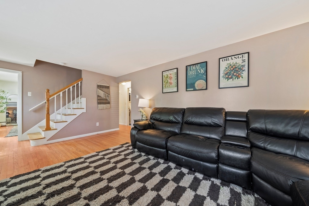 55 Running Brook Road Boston, MA 02132 - Photo 8 of 32 a living room with furniture and a rug