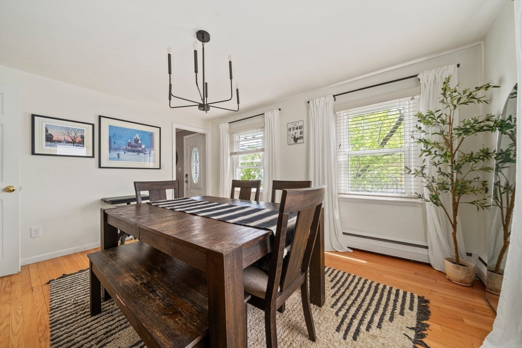 55 Running Brook Road Boston, MA 02132 - Photo 10 of 32 a view of a dining room with furniture window and wooden floor