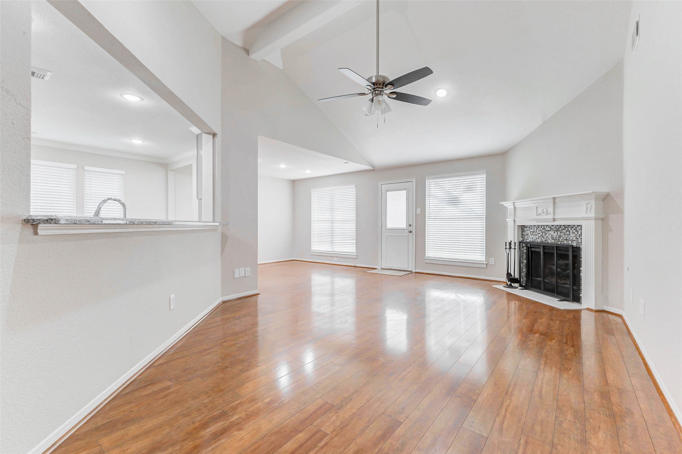 2410 Clear Ridge Drive Houston, TX 77339 - Photo 11 of 24 a view of empty room with wooden floor and fireplace