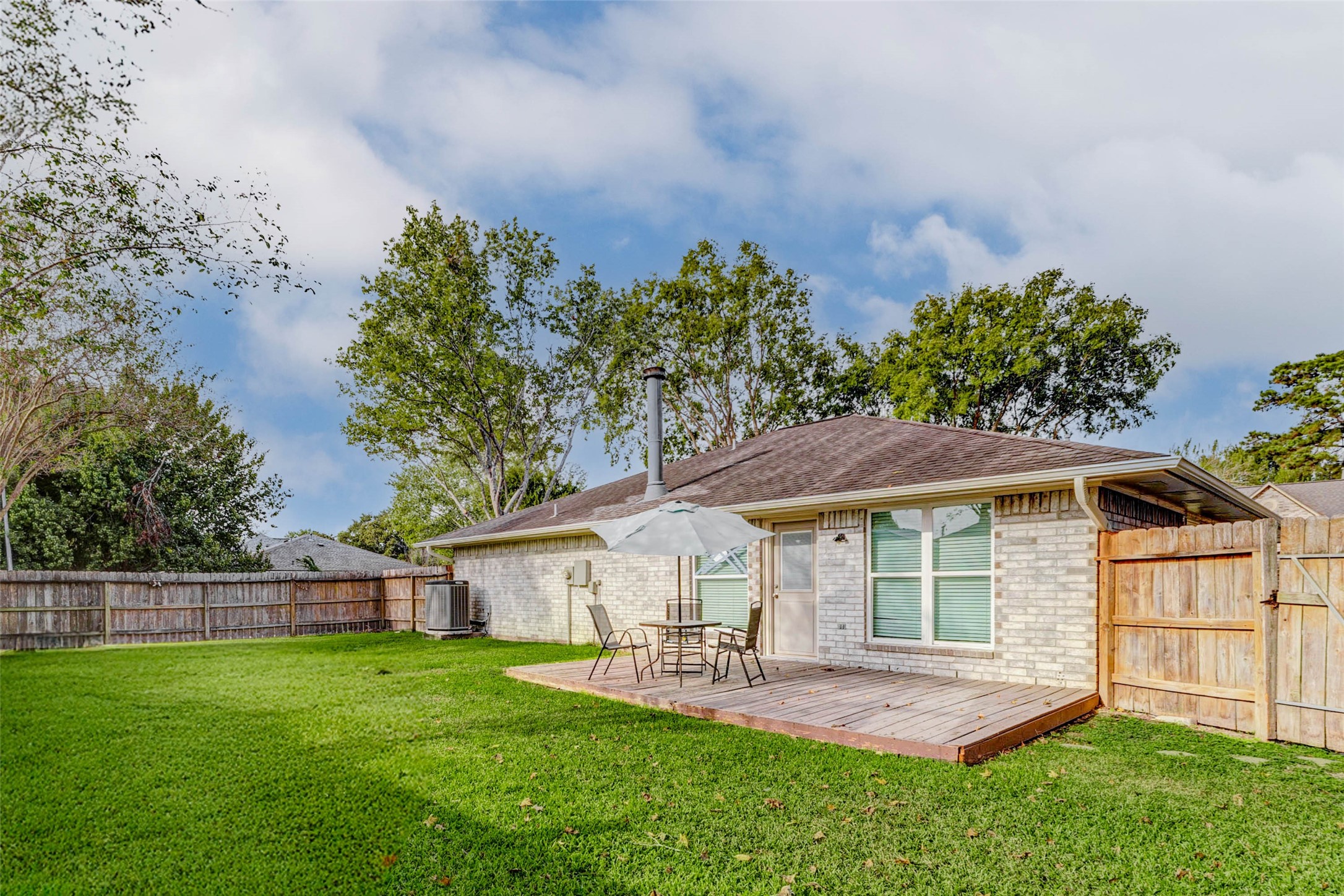 2410 Clear Ridge Drive Houston, TX 77339 - Photo 14 of 24 a view of a house with a yard and sitting area