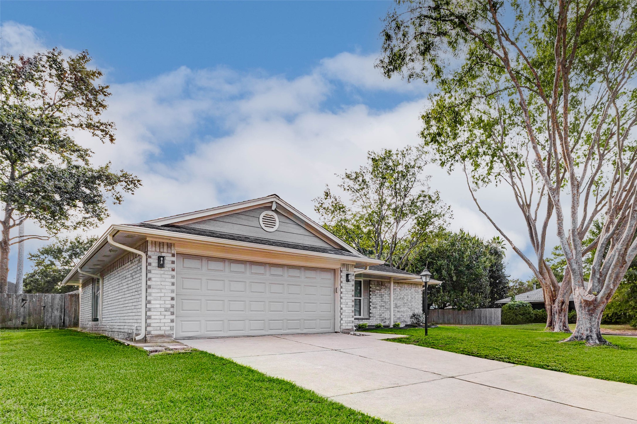 2410 Clear Ridge Drive Houston, TX 77339 - Photo 2 of 24 front view of house with a yard and an trees