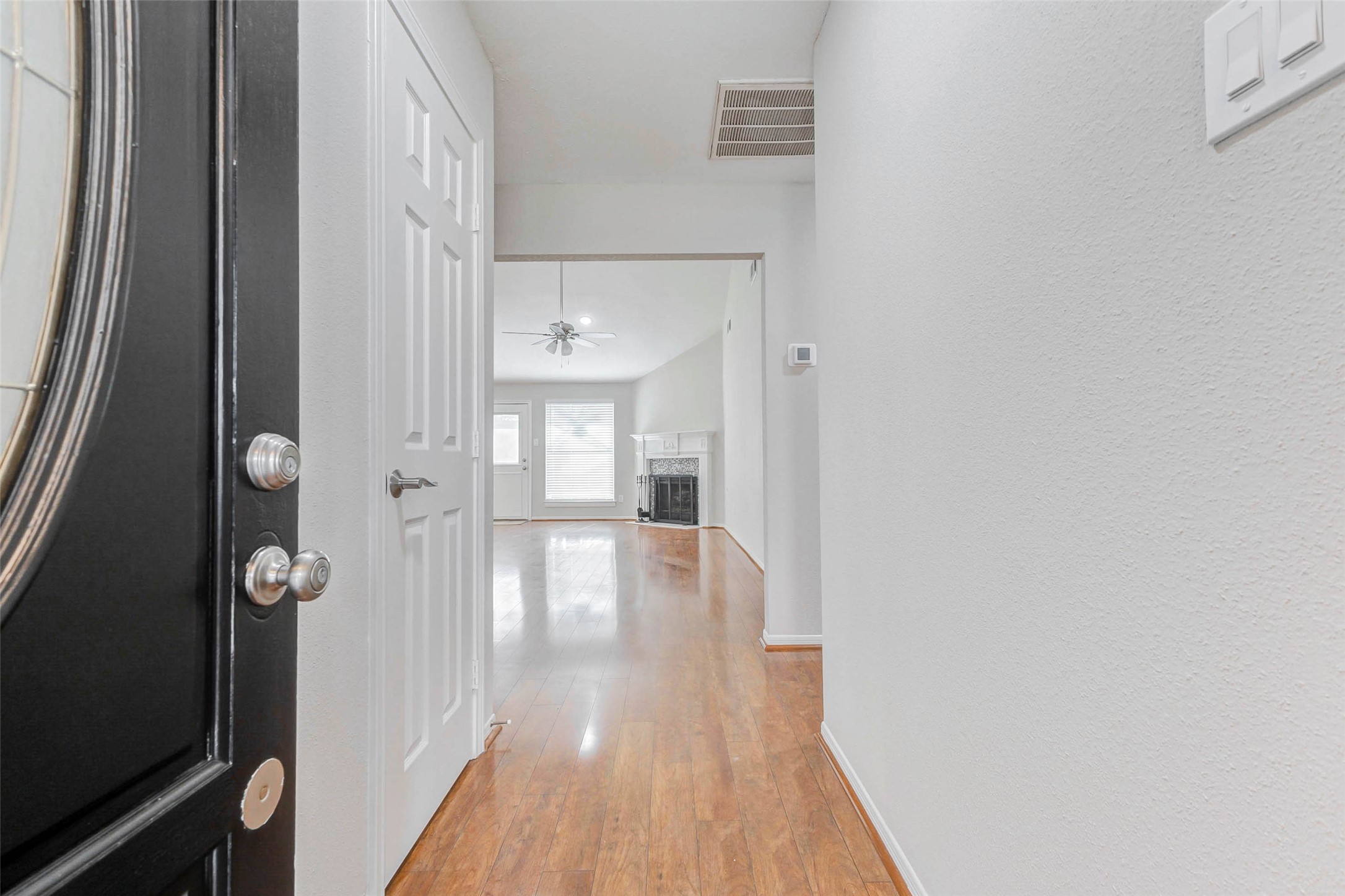 2410 Clear Ridge Drive Houston, TX 77339 - Photo 4 of 24 a view of a hallway with wooden floor and staircase